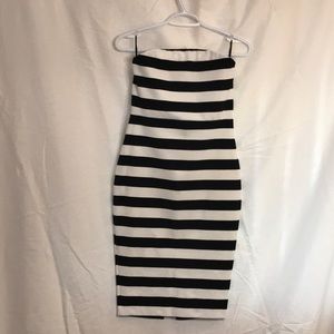Express dress. Black/white horizontal stripes. Back zip & slit. Size 4.